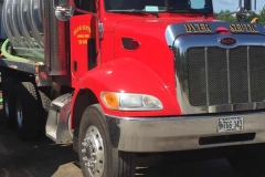 dyer-septic-harrison-maine-red-truck-silver-tank-logo